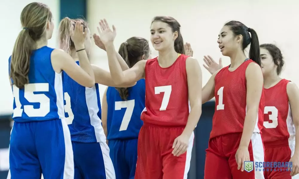 Girls sports team high five