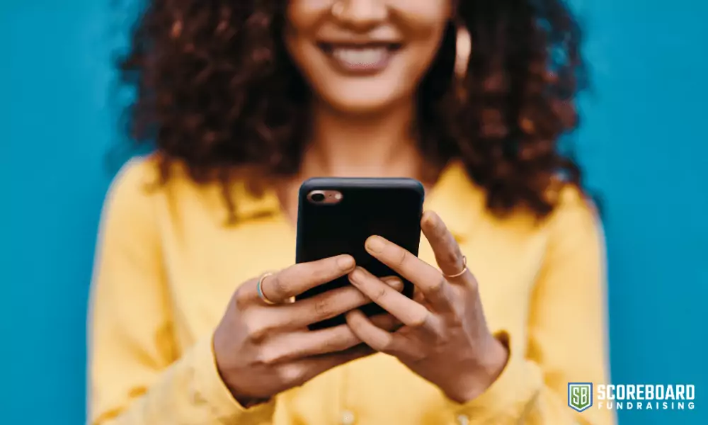 Woman holding a cell phone.